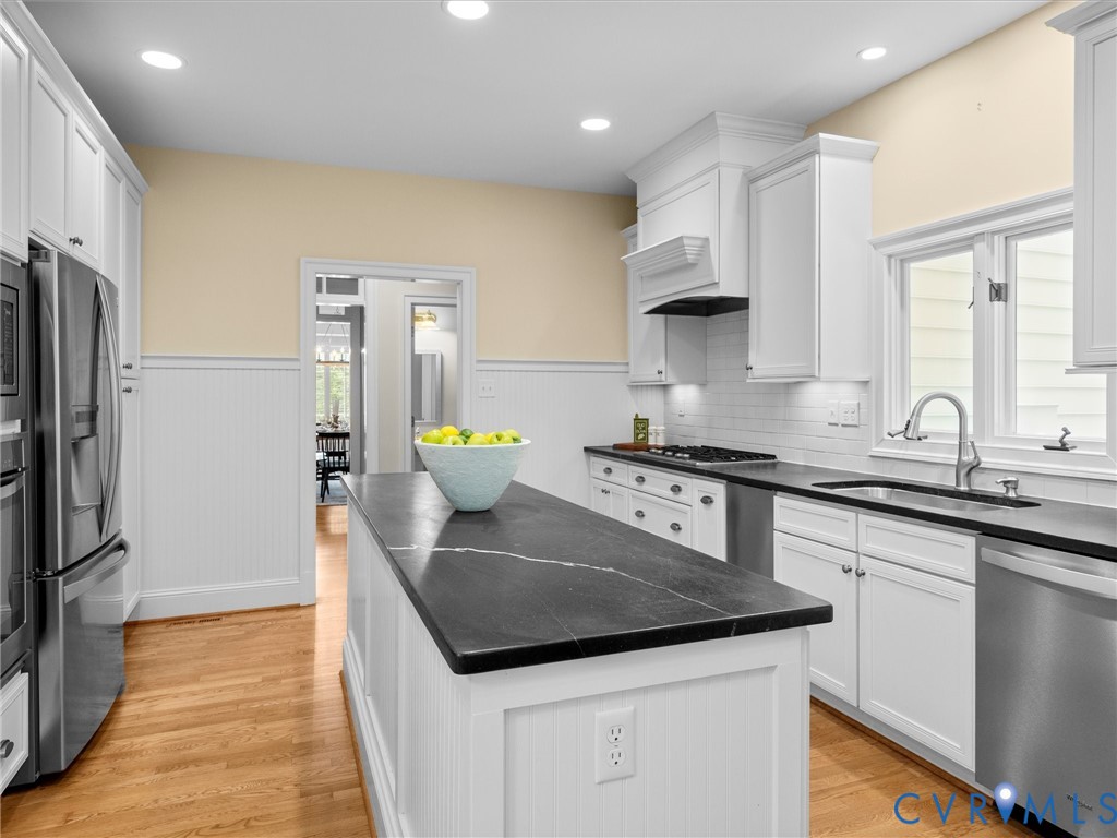 2011 Gamelaw Court Midlothian, VA 23113 - Photo 29 of 77 a kitchen with granite countertop a sink and a refrigerator
