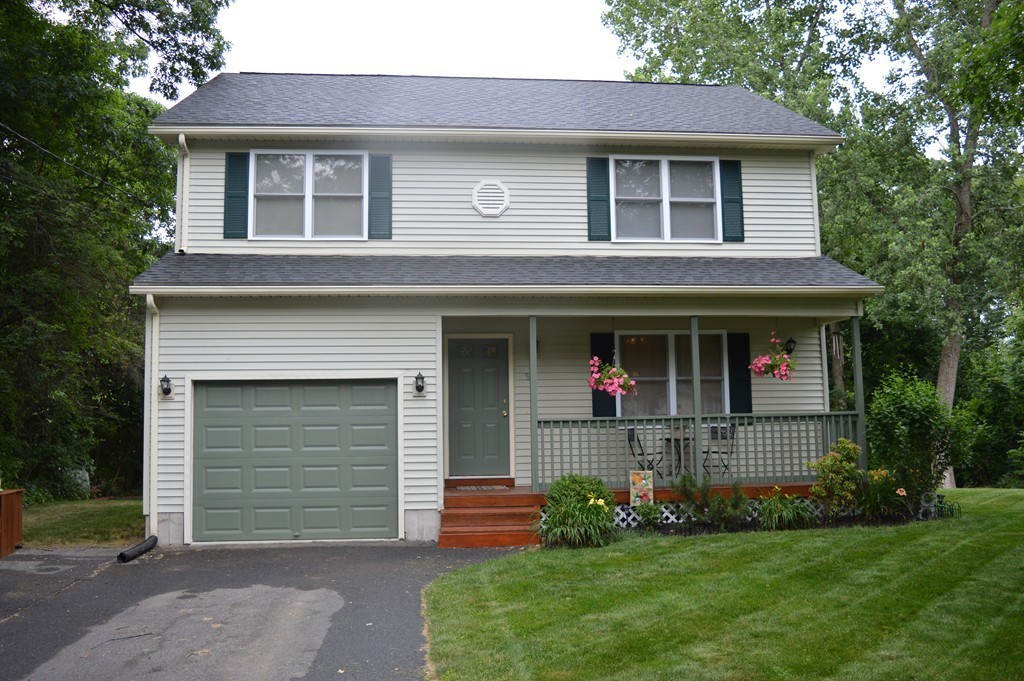 83 Stuart Street Springfield, MA 01119 - Photo 1 of 17 a front view of a house with a yard