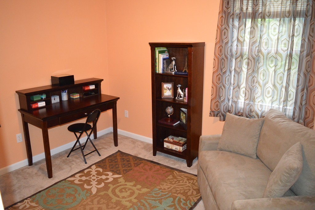 83 Stuart Street Springfield, MA 01119 - Photo 15 of 17 a living room with furniture and a window