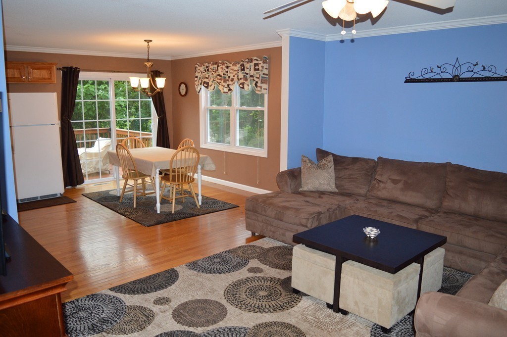 83 Stuart Street Springfield, MA 01119 - Photo 3 of 17 a living room with furniture and a large window