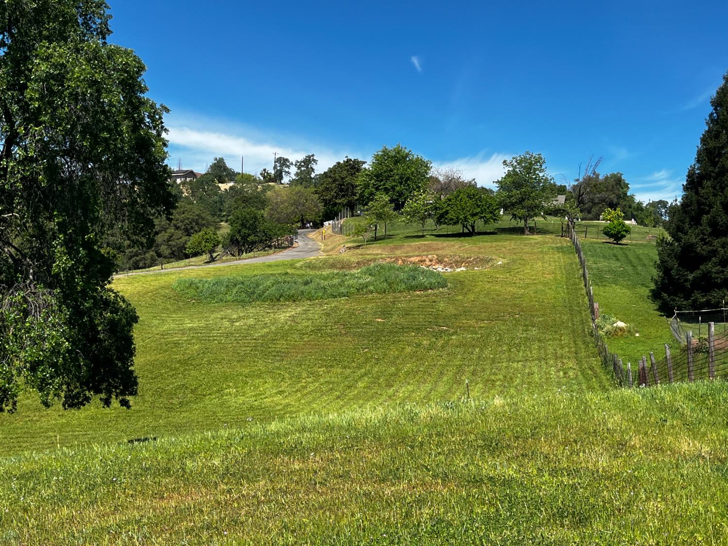 0 Butler Road Penryn, CA 95663 - Photo 2 of 19 a view of a lake with houses in the background