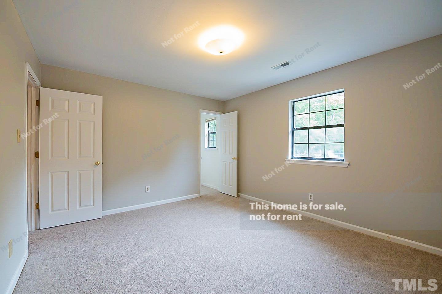 837 Horton Road Durham, NC 27704 - Photo 15 of 19 an empty room with windows