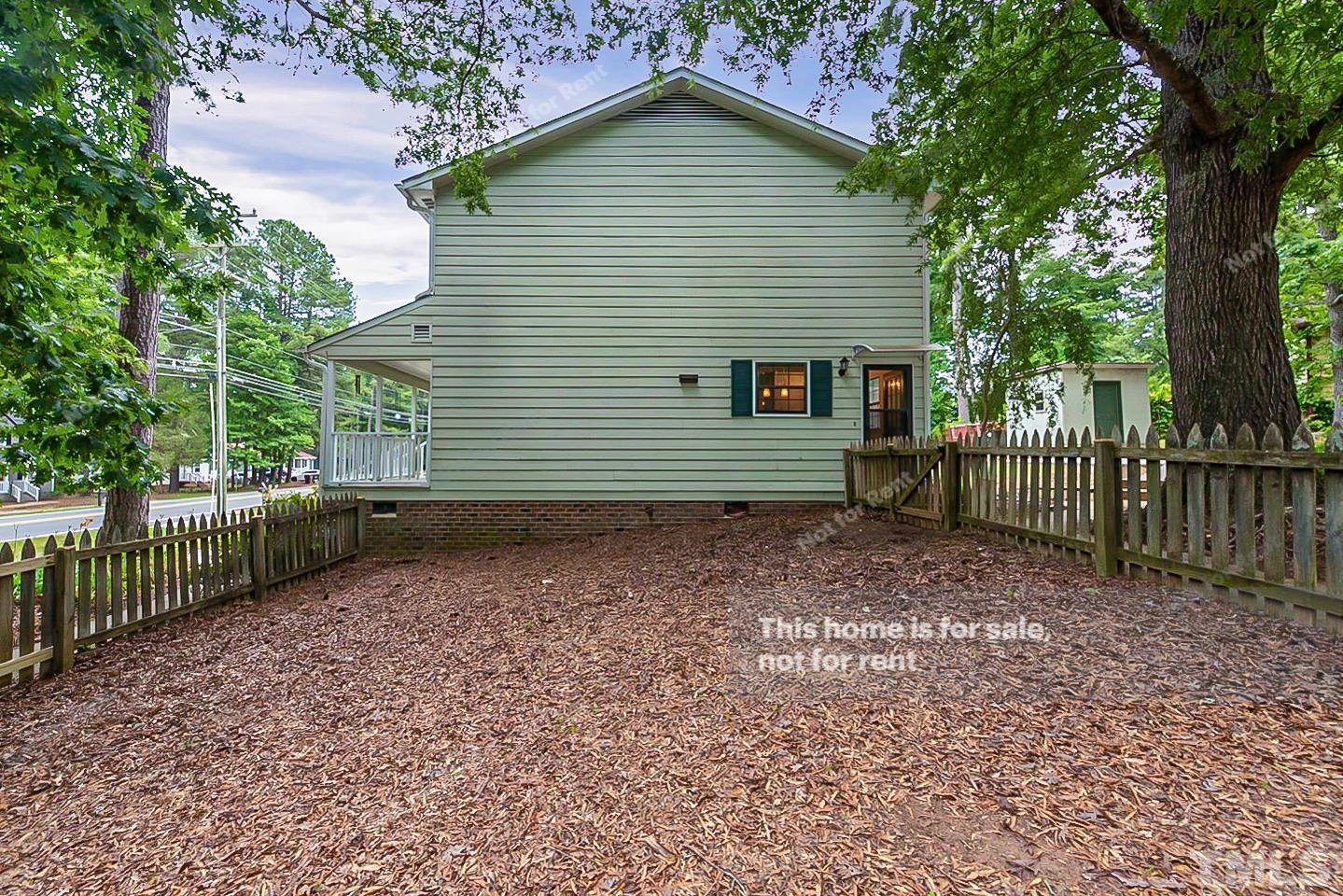 837 Horton Road Durham, NC 27704 - Photo 18 of 19 a front view of a house with a garden