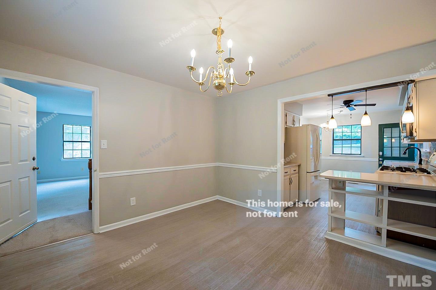837 Horton Road Durham, NC 27704 - Photo 9 of 19 wooden floor in an empty room with a window