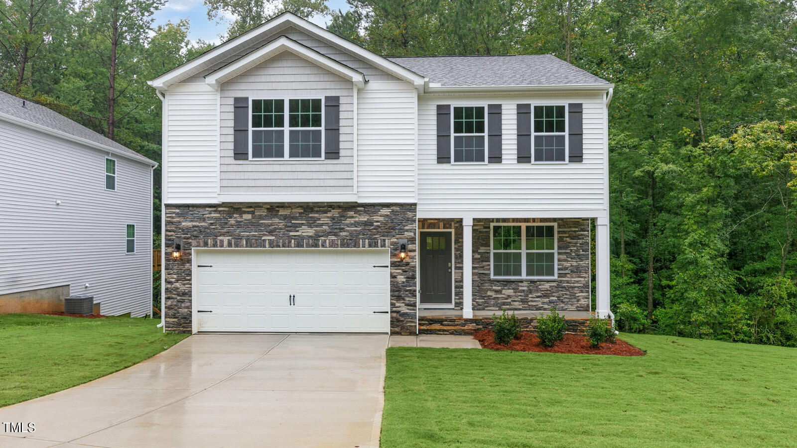 3125 White Memorial Church Road Willow Spring, NC 27592 - Photo 1 of 56 a front view of a house with a yard and garage