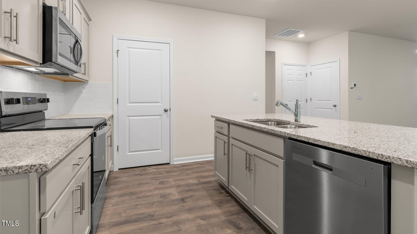 3125 White Memorial Church Road Willow Spring, NC 27592 - Photo 8 of 56 a kitchen with stainless steel appliances granite countertop a sink stove and cabinets