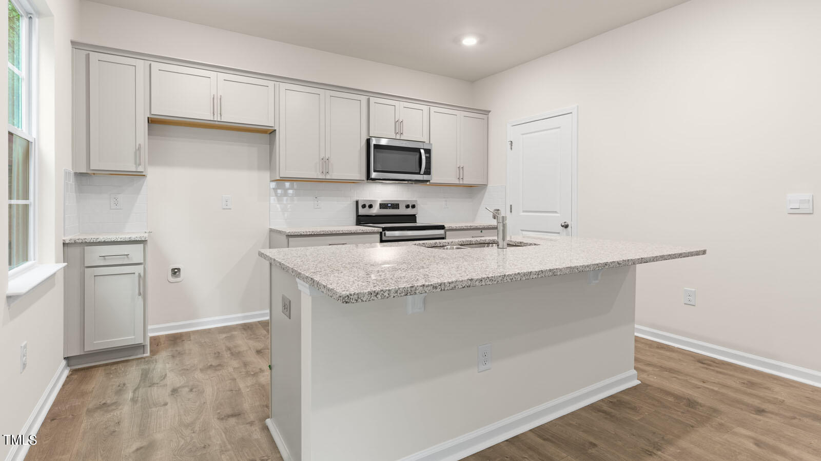 3125 White Memorial Church Road Willow Spring, NC 27592 - Photo 9 of 56 a kitchen with stainless steel appliances a sink stove and refrigerator