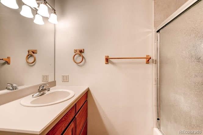 206 South Oman Road Castle Rock, CO 80104 - Photo 16 of 25 a bathroom with a sink and a mirror
