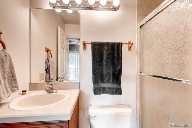 206 South Oman Road Castle Rock, CO 80104 - Photo 18 of 25 a bathroom with a sink and a mirror