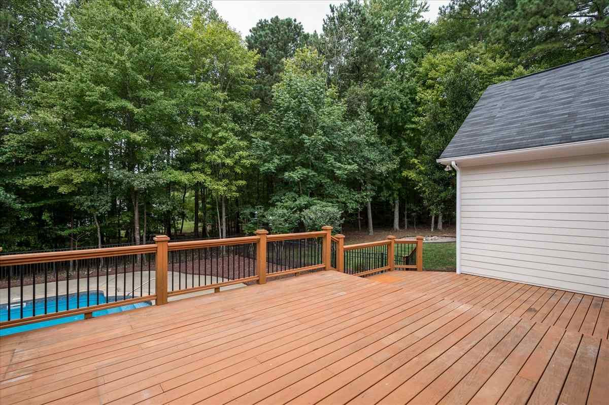 5245 Bartons Enclave Lane Raleigh, NC 27613 - Photo 23 of 27 Very large 2 tier deck accessed off of Family Room is perfect for all your entertaining needs. Spacious for outdoor dining, lounging, grilling.. Overlook the 41 x20 in ground Heated Saltwater Pool and private fenced backyard. Exterior Back/Deck