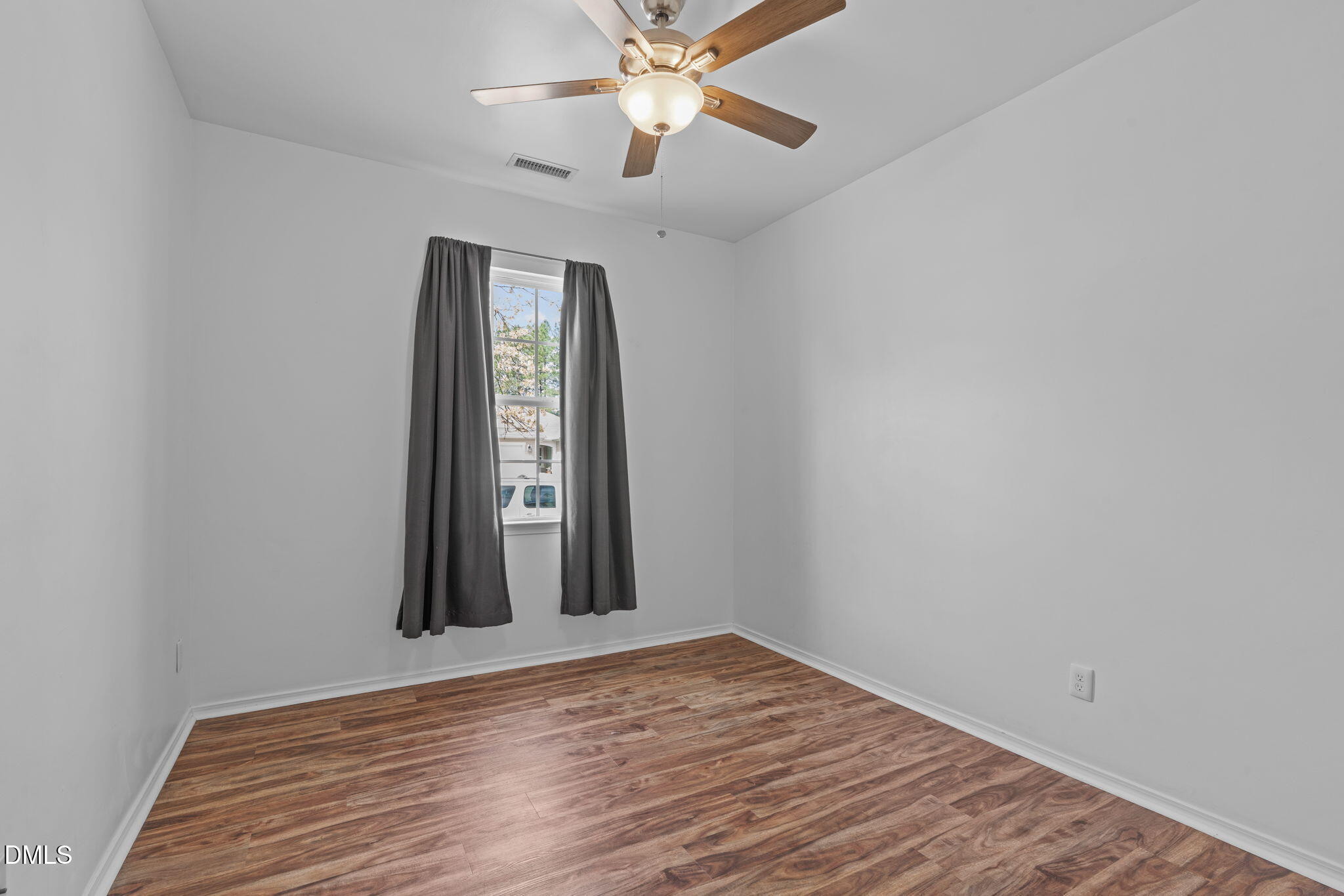 124 Daneborg Road Durham, NC 27703 - Photo 8 of 40 wooden floor in an empty room with a window