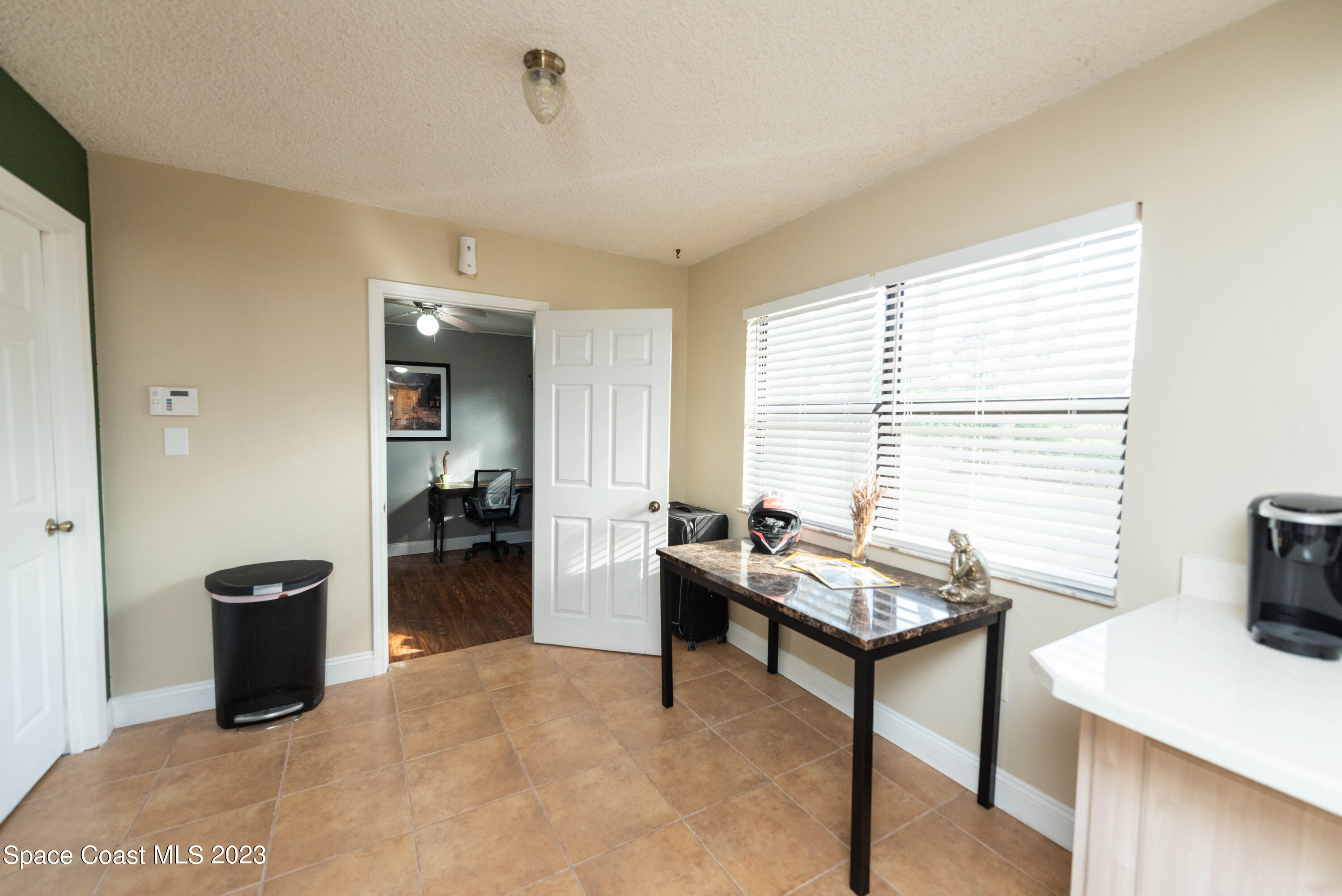 4929 Bridge Road Cocoa, FL 32927 - Photo 8 of 37 a reading room with furniture and a window