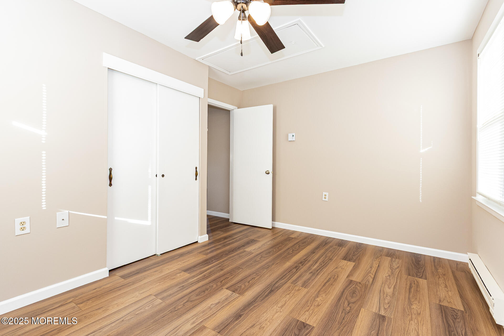 49 Westport Drive, Unit 71 Whiting, NJ 08759 - Photo 11 of 15 a view of an empty room with wooden floor