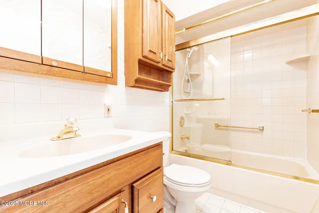 a bathroom with a sink a toilet and a bathtub