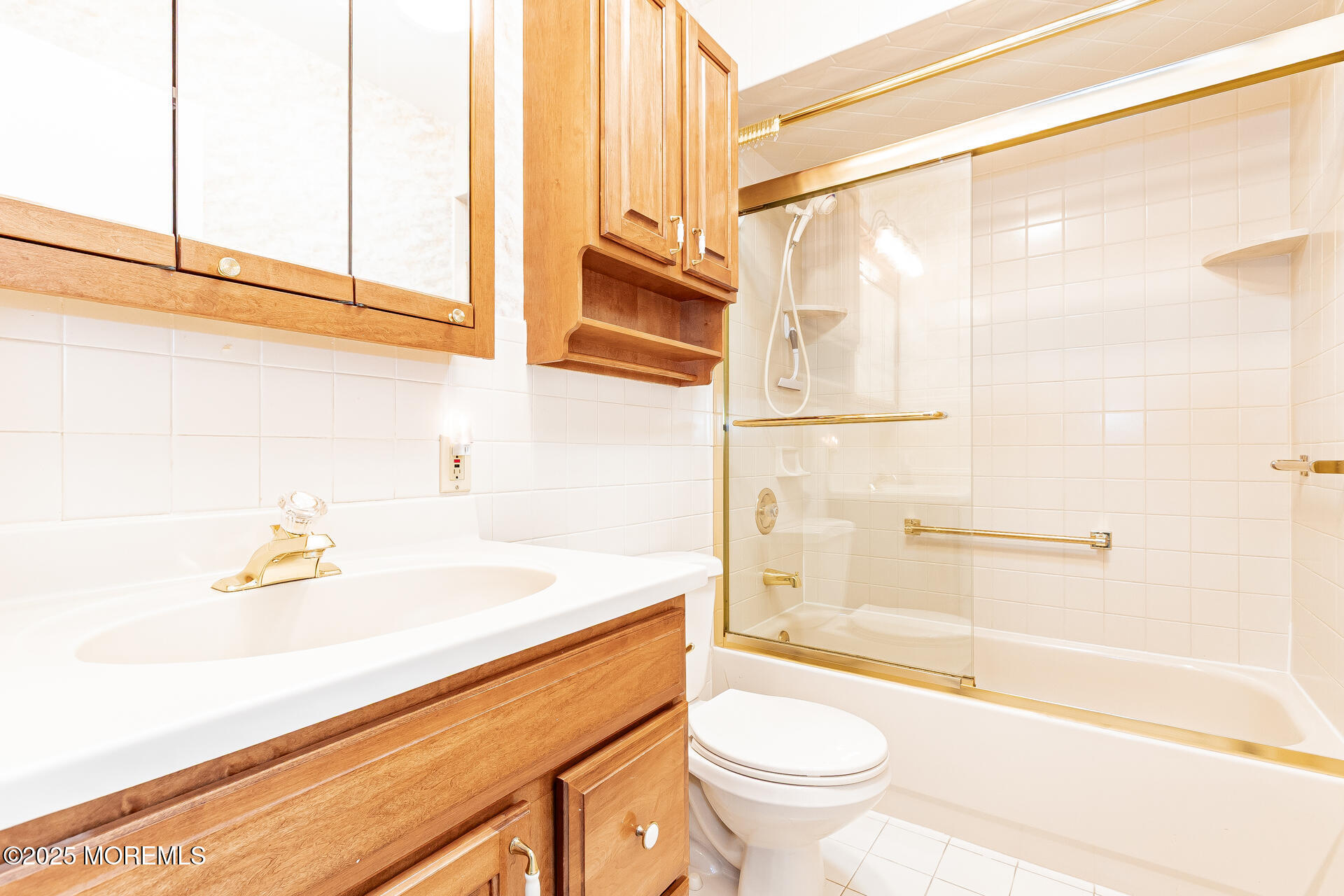 49 Westport Drive, Unit 71 Whiting, NJ 08759 - Photo 14 of 15 a bathroom with a sink a toilet and a bathtub