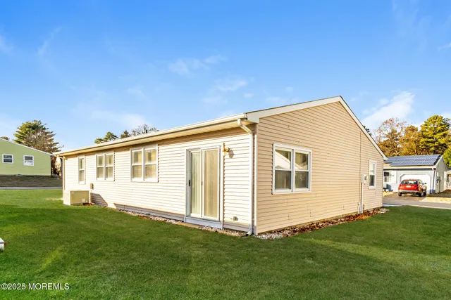 a view of a house with a backyard