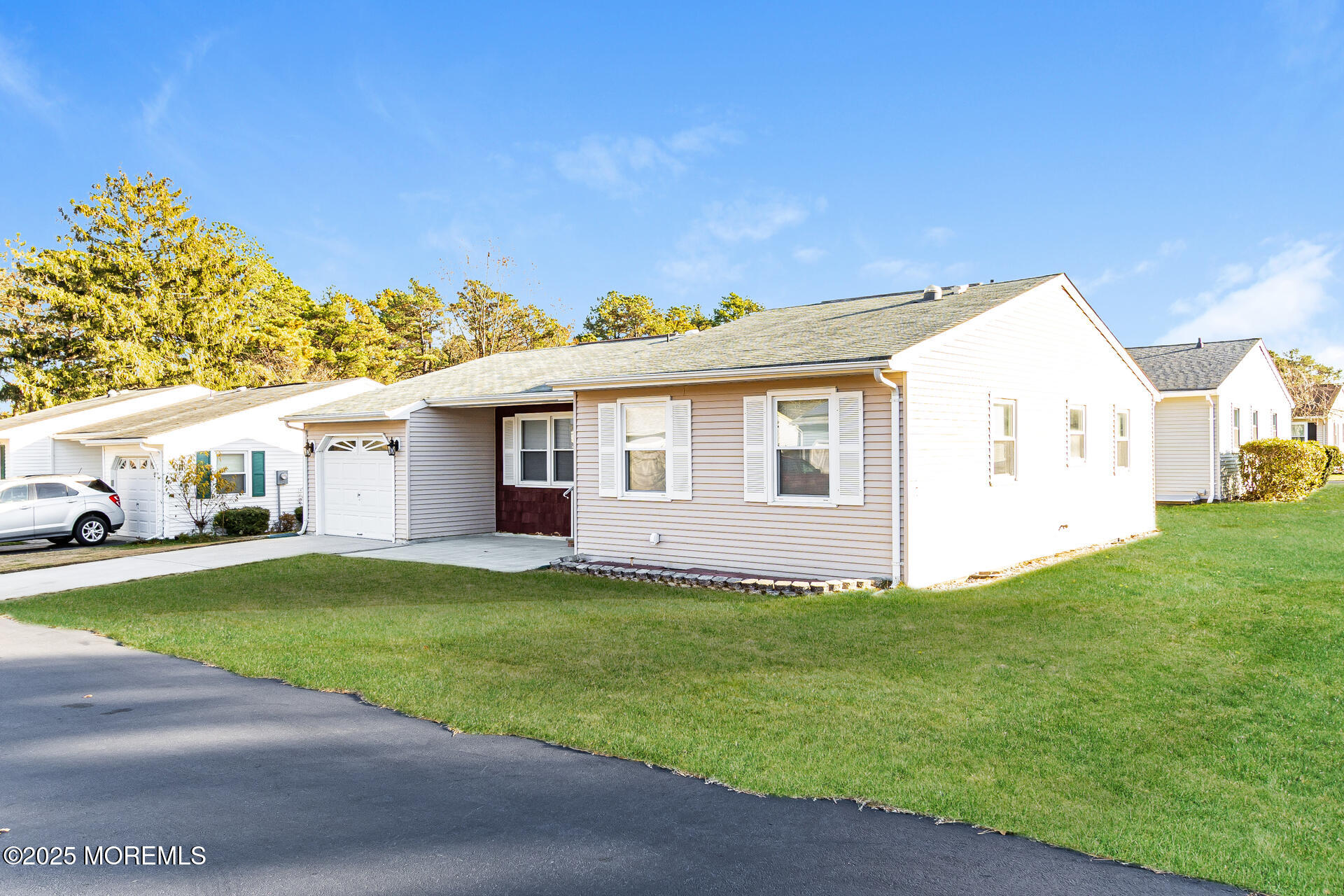 49 Westport Drive, Unit 71 Whiting, NJ 08759 - Photo 2 of 15 a view of a house with a yard