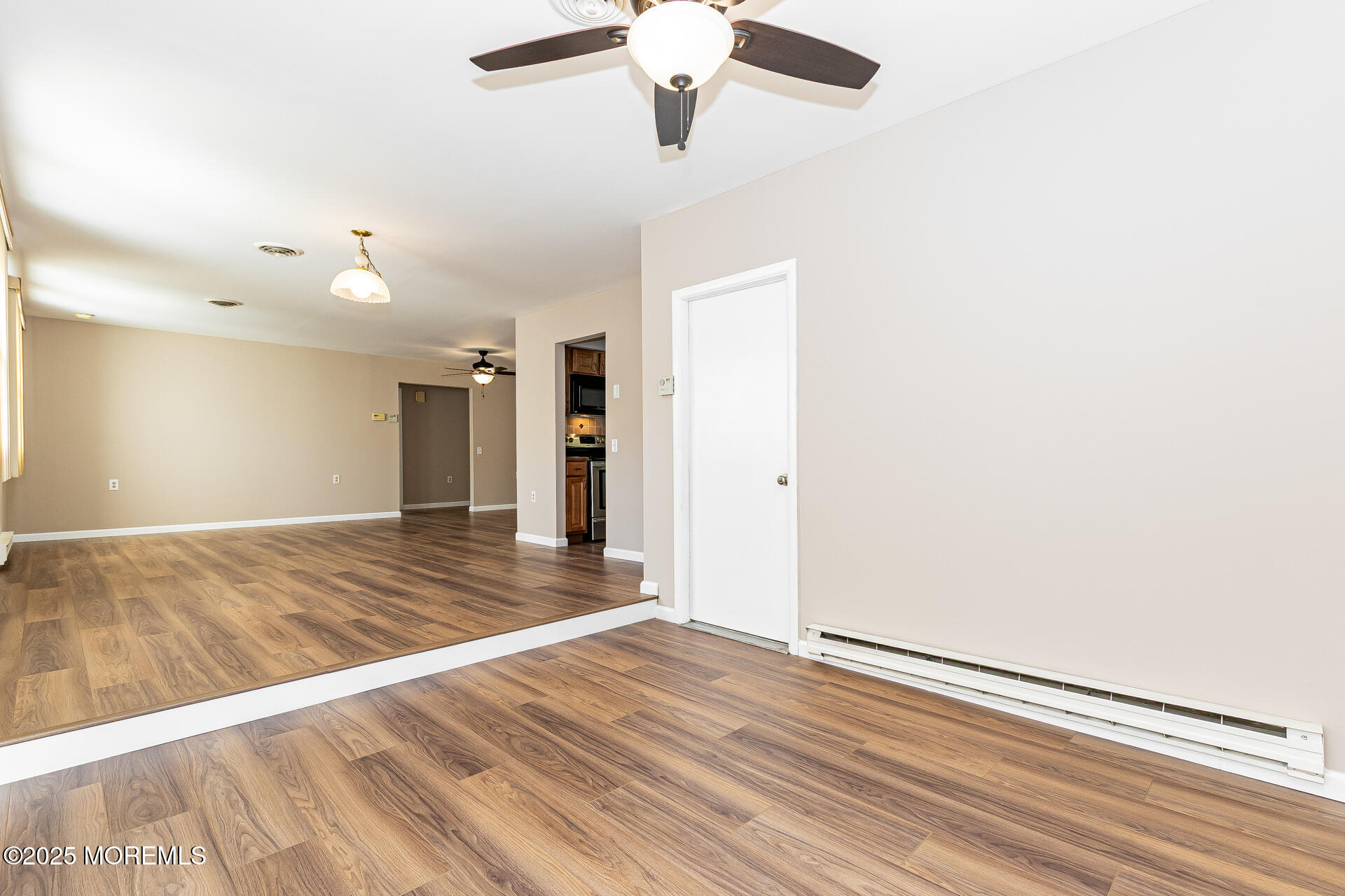 49 Westport Drive, Unit 71 Whiting, NJ 08759 - Photo 6 of 15 a view of empty room with wooden floor