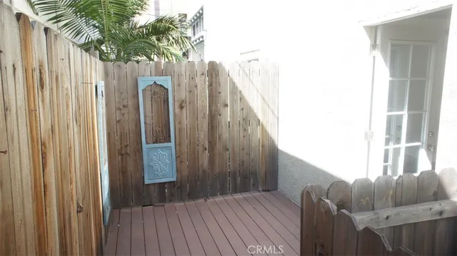 a view of a wooden floor and door