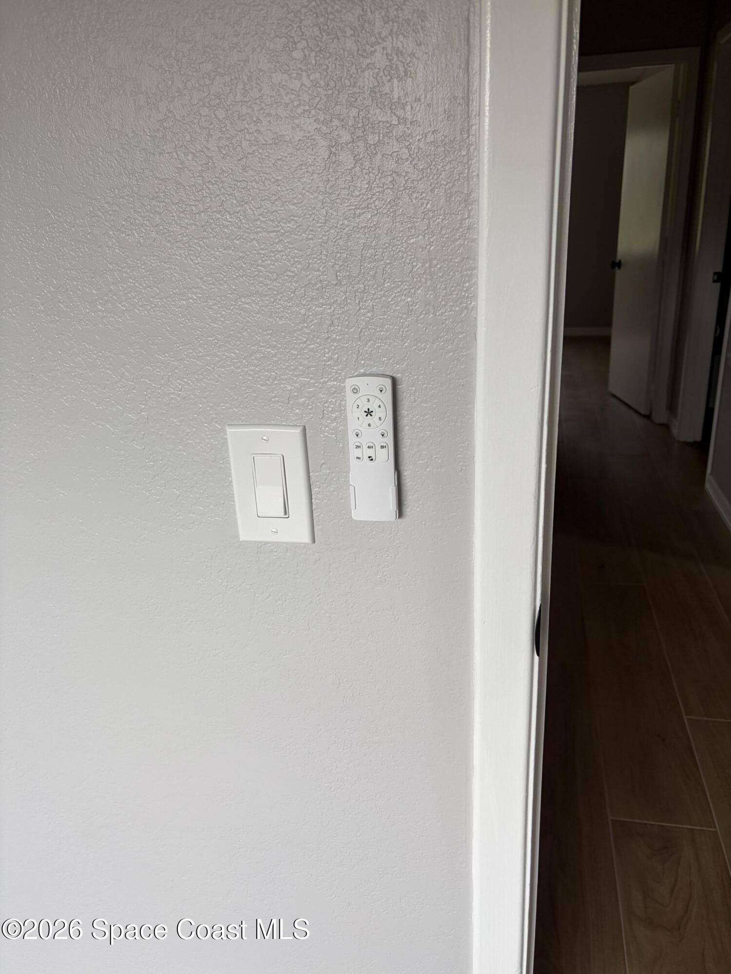 1136 Minnet Court Northeast Palm Bay, FL 32905 - Photo 7 of 31 Switch and remote for fan