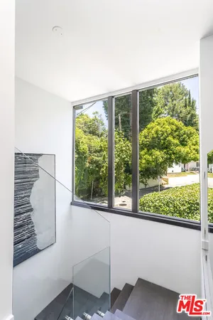 a view of a room with a large window