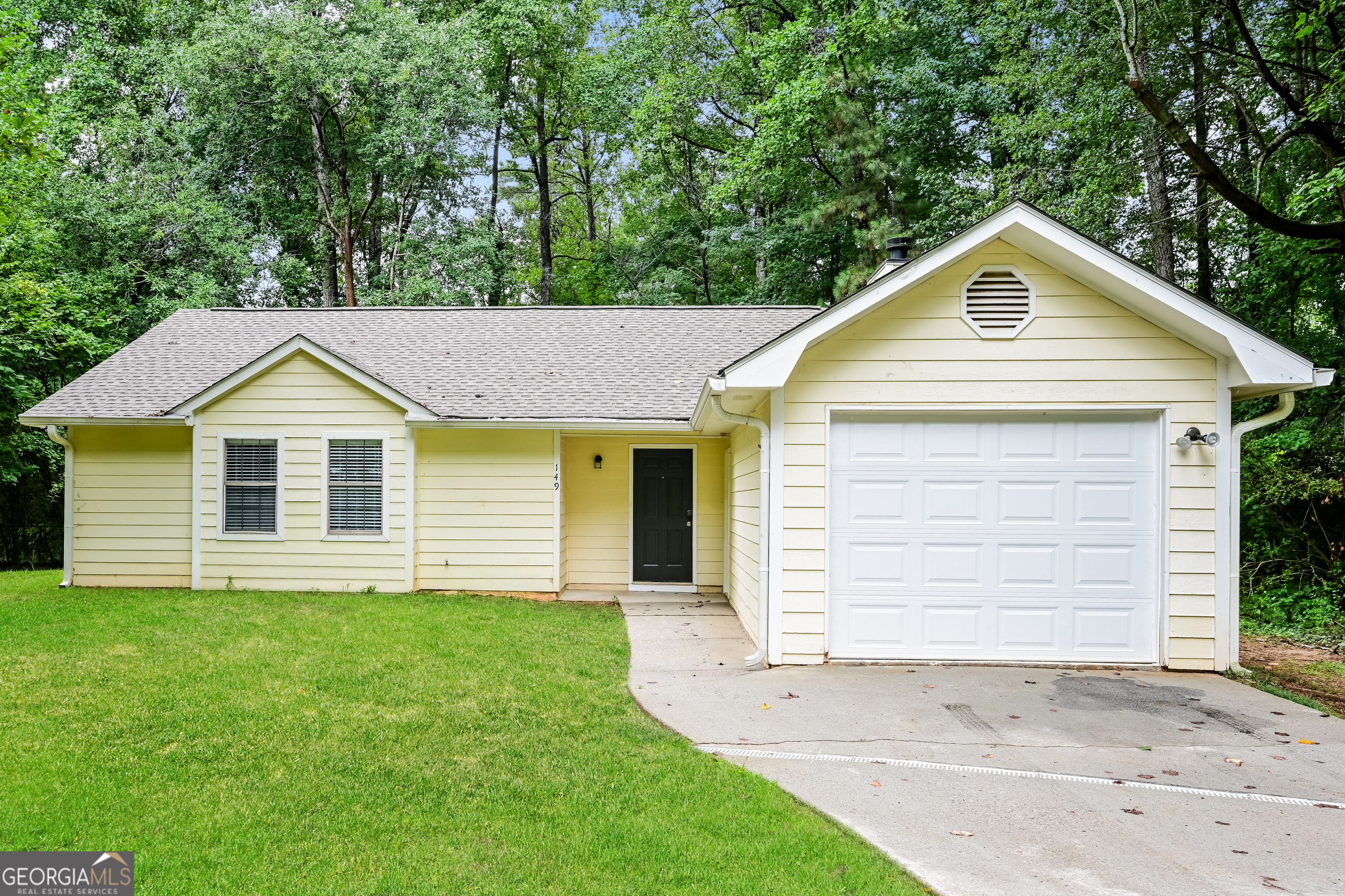 a view of a backyard of the house
