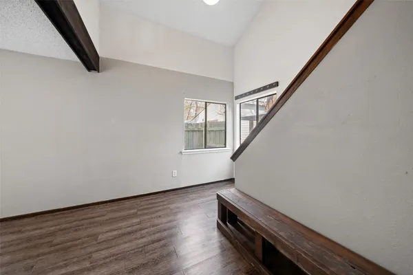a view of wooden floor with stairs
