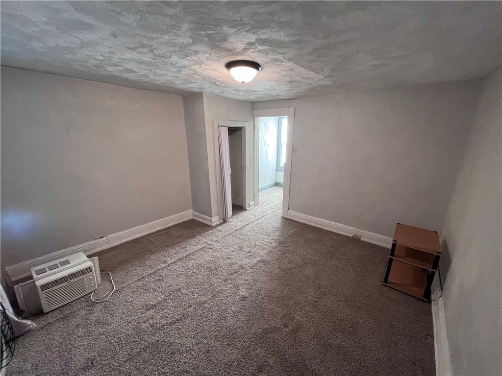 725 Clarissa Street Pittsburgh, PA 15219 - Photo 11 of 17 an empty room with a projector