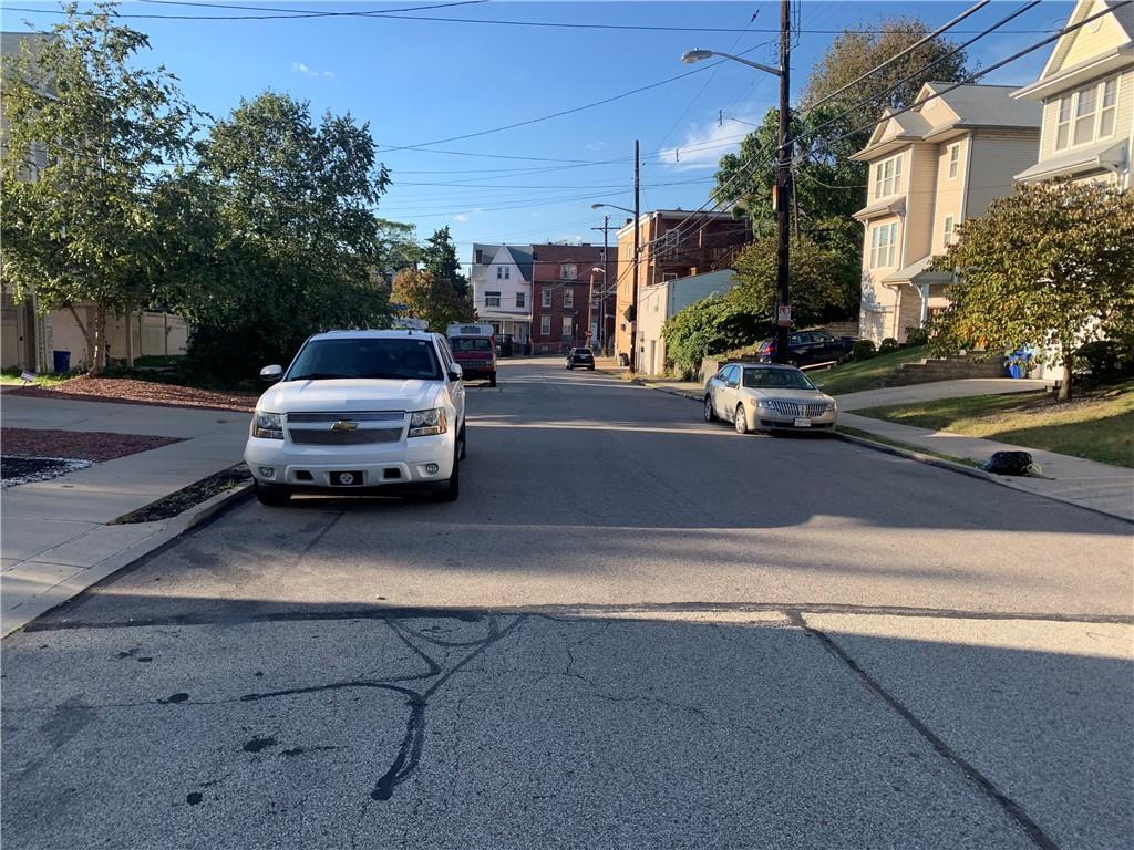 725 Clarissa Street Pittsburgh, PA 15219 - Photo 3 of 17 a car parked on the side of a street