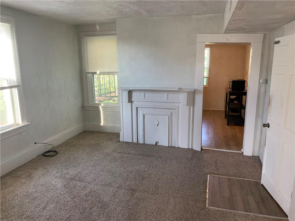 725 Clarissa Street Pittsburgh, PA 15219 - Photo 5 of 17 an empty room with windows and closet