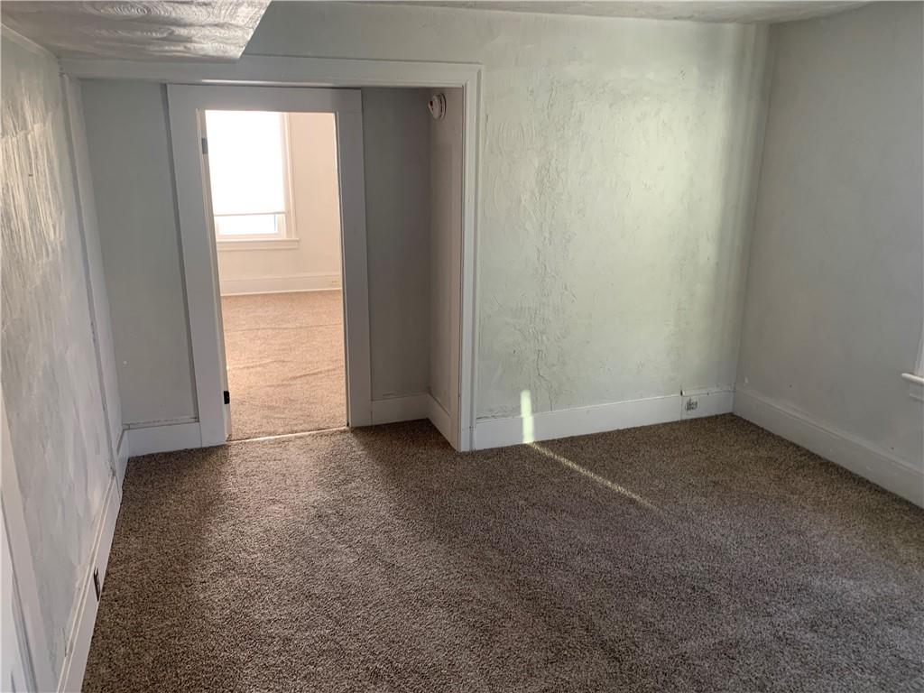 725 Clarissa Street Pittsburgh, PA 15219 - Photo 6 of 17 an empty room with a window