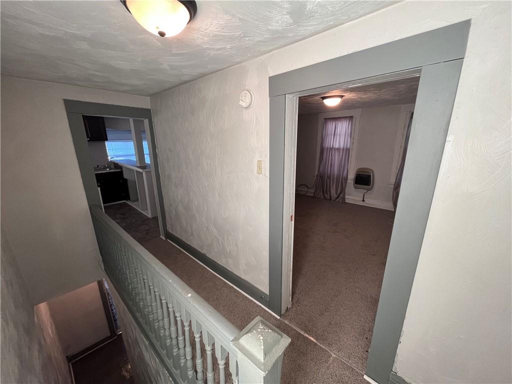 725 Clarissa Street Pittsburgh, PA 15219 - Photo 10 of 17 a view of a hallway and a livingroom with furniture