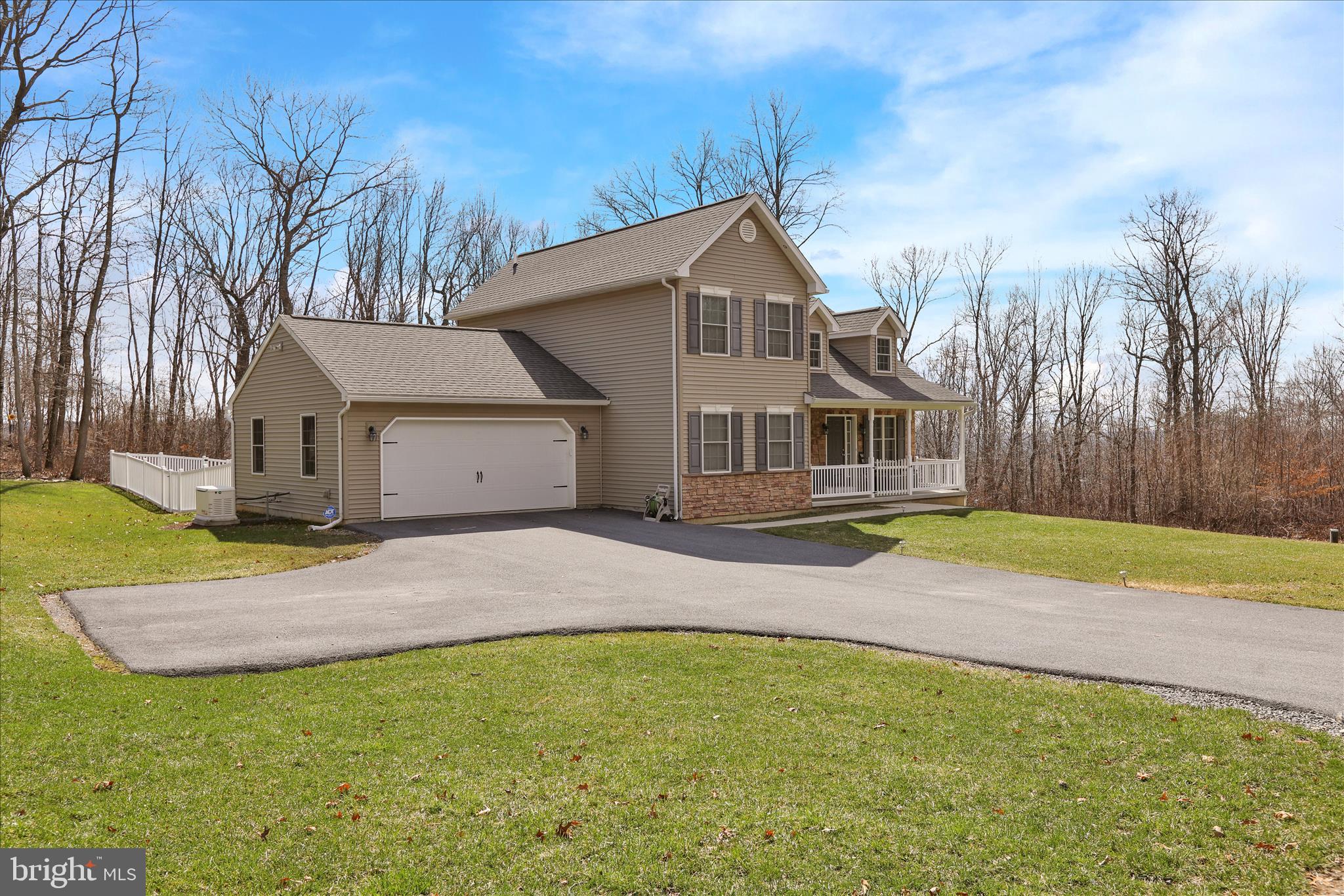402 Mountainside Road Temple, PA 19560 - Photo 17 of 75 a front view of a house with a yard