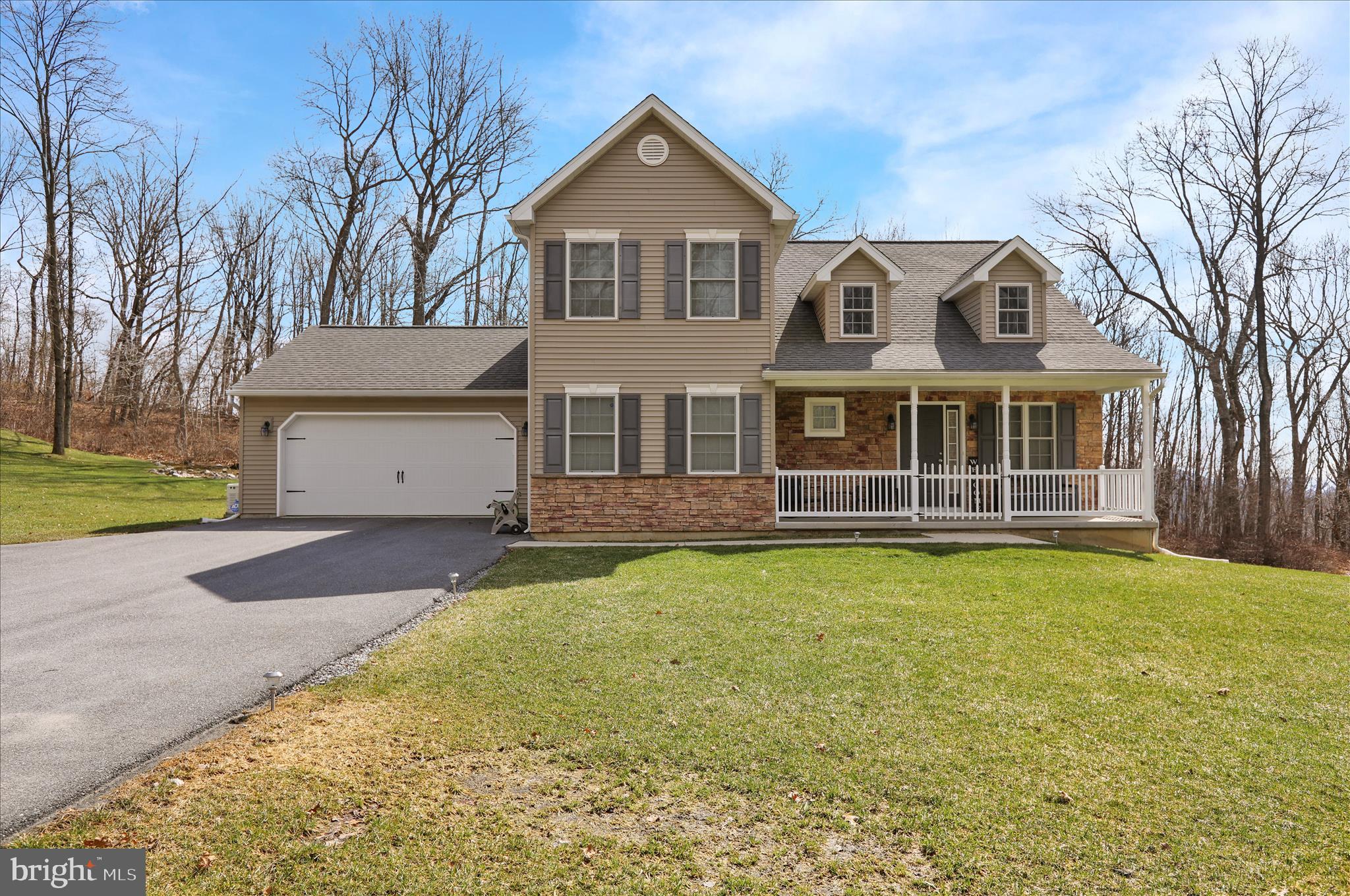 402 Mountainside Road Temple, PA 19560 - Photo 18 of 75 a front view of a house with a garden