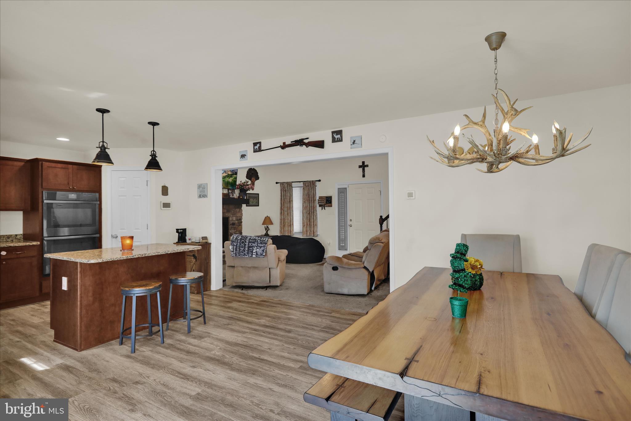 402 Mountainside Road Temple, PA 19560 - Photo 27 of 75 a view of a dining room with furniture wooden floor and chandelier
