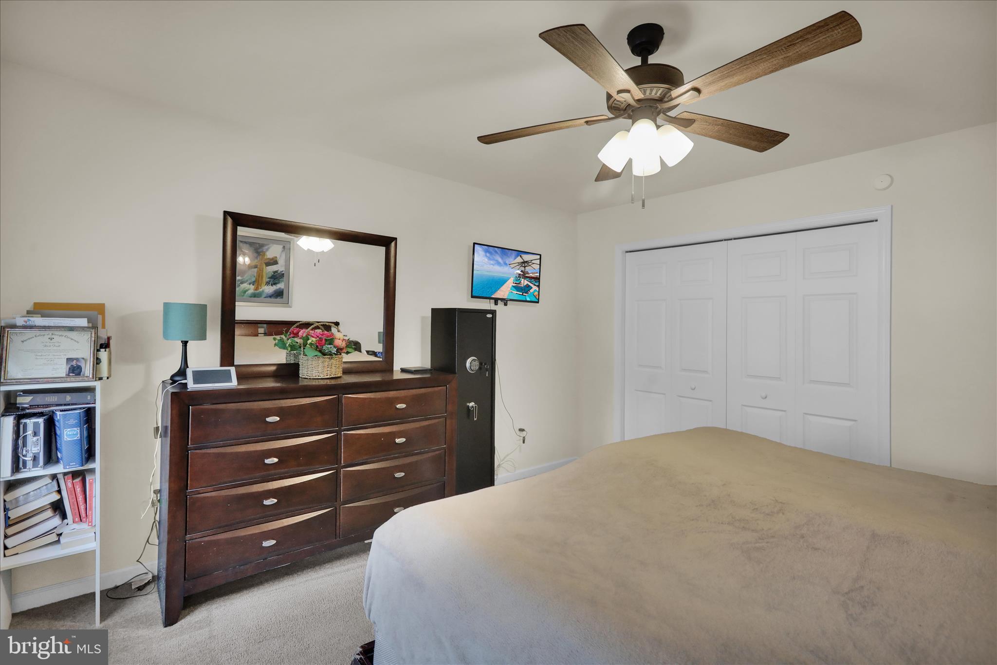 402 Mountainside Road Temple, PA 19560 - Photo 31 of 75 a bedroom with a bed and a chandelier