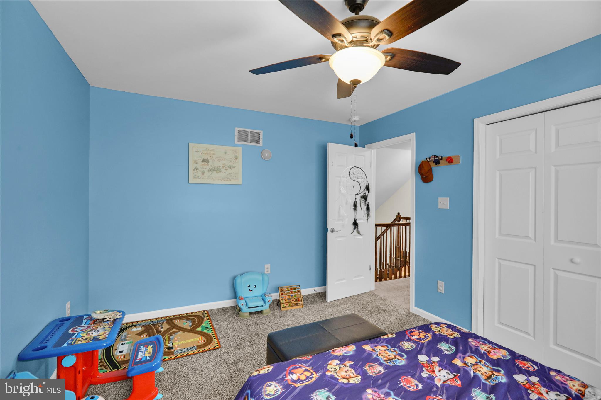 402 Mountainside Road Temple, PA 19560 - Photo 36 of 75 a bedroom with a bed and a chandelier
