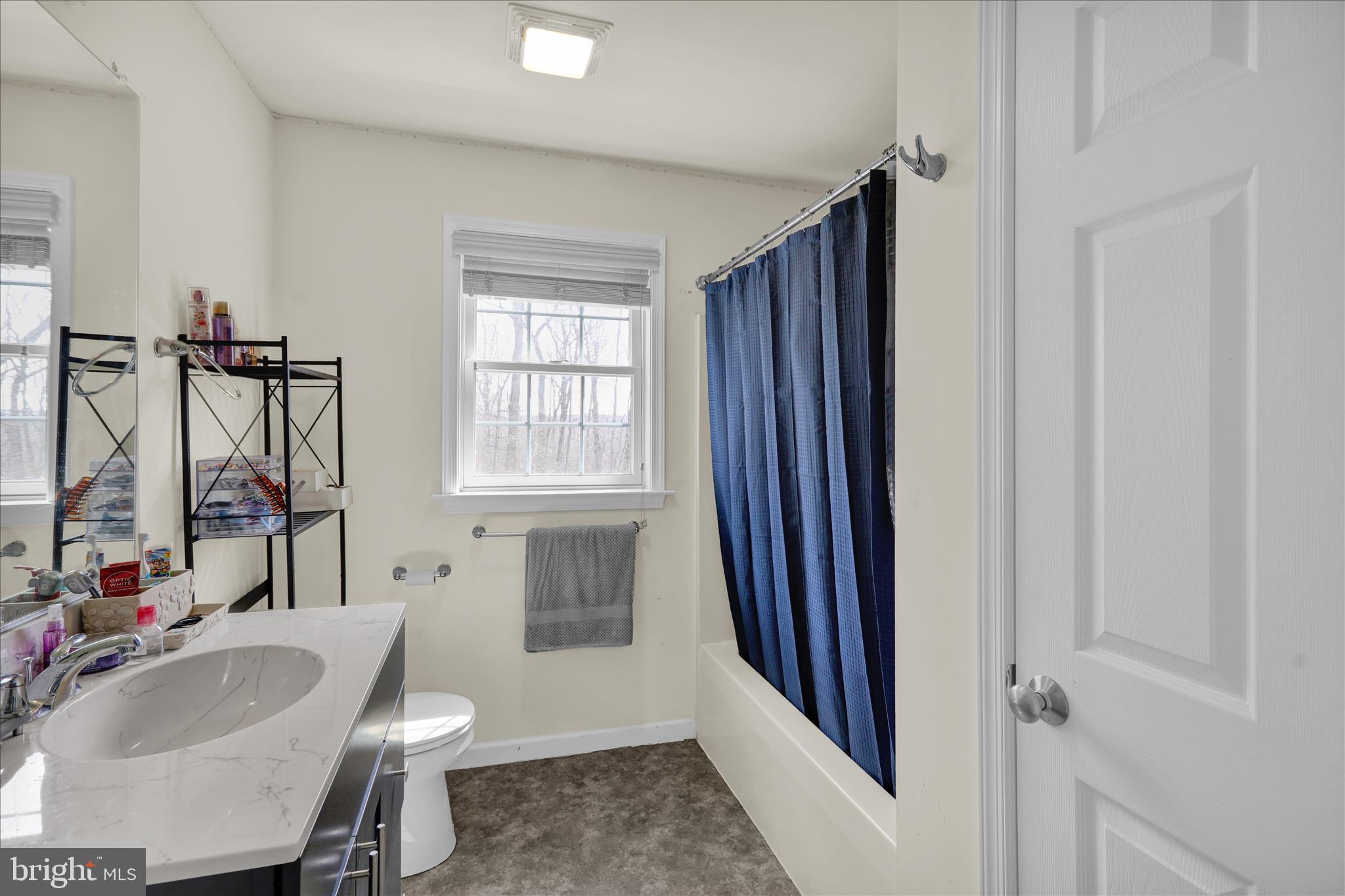 402 Mountainside Road Temple, PA 19560 - Photo 37 of 75 a bathroom with a sink toilet and shower