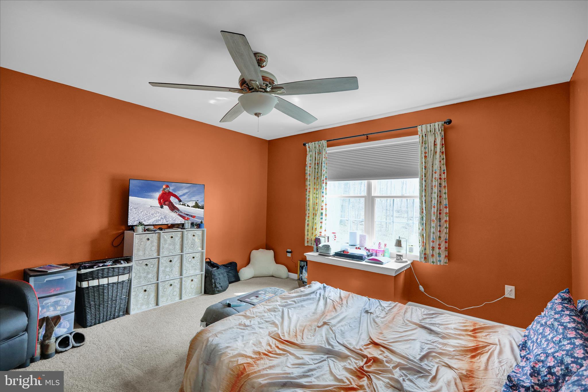 402 Mountainside Road Temple, PA 19560 - Photo 39 of 75 a bedroom with a bed and a chandelier