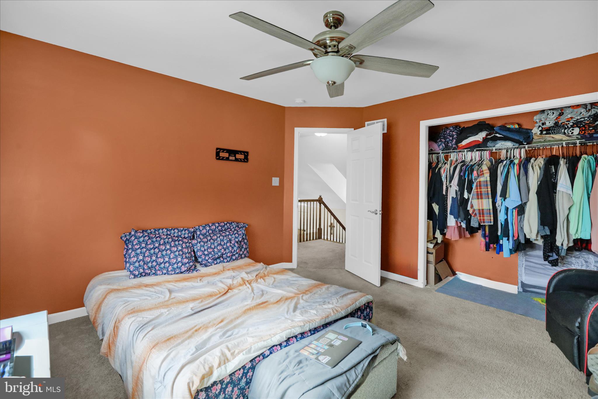 402 Mountainside Road Temple, PA 19560 - Photo 40 of 75 a bedroom with a bed and a chandelier