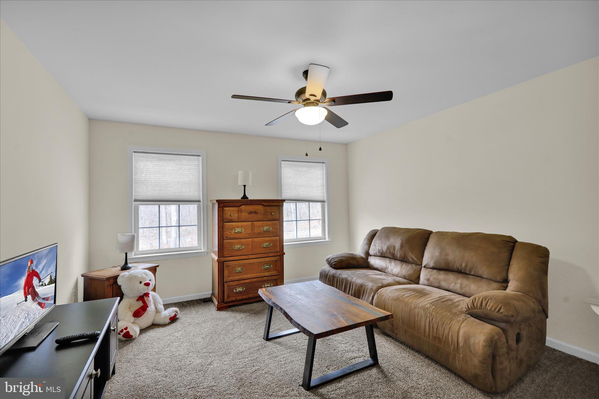 402 Mountainside Road Temple, PA 19560 - Photo 41 of 75 a living room with furniture a ceiling fan and a window