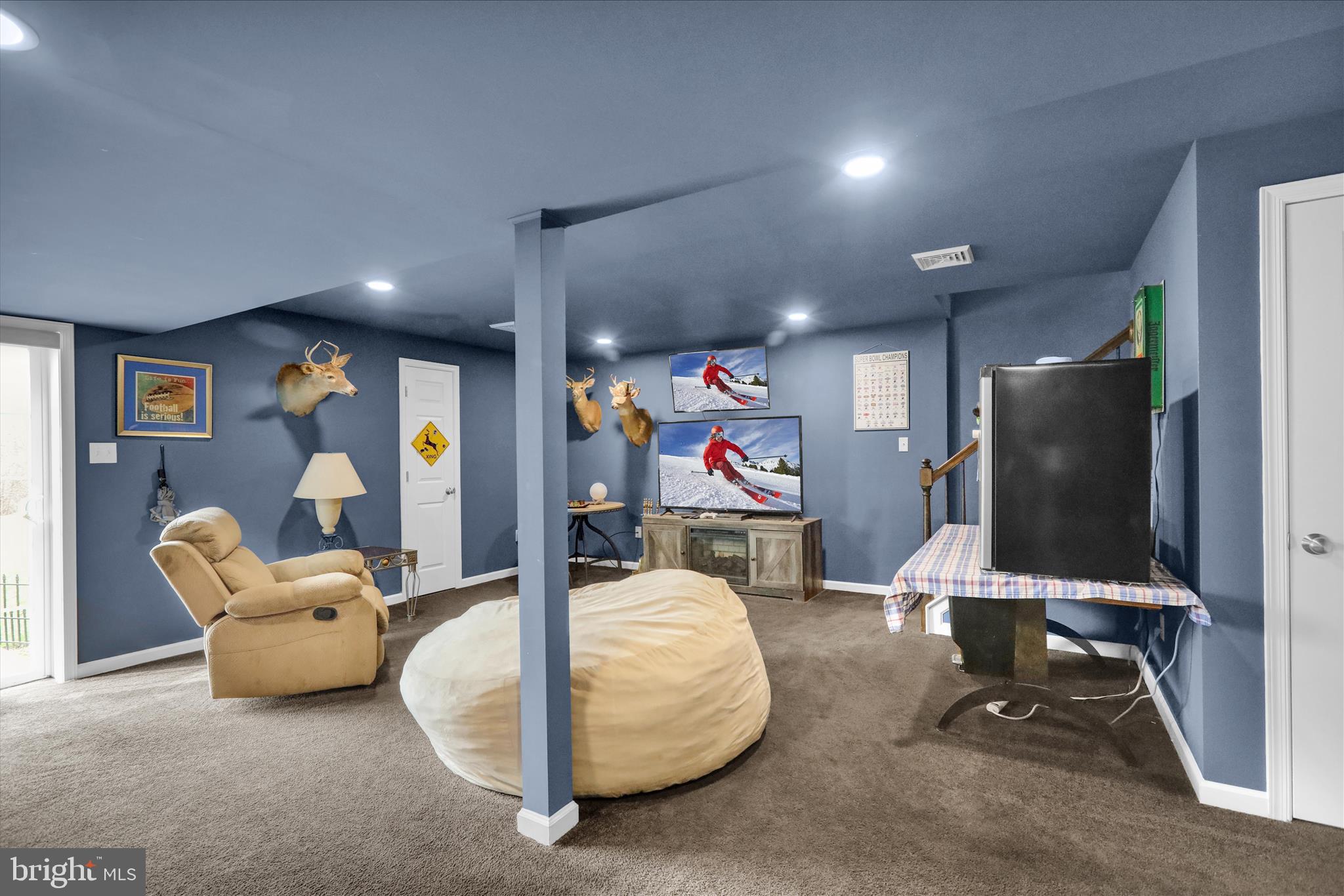 402 Mountainside Road Temple, PA 19560 - Photo 44 of 75 a room with gym equipment and a flat screen tv