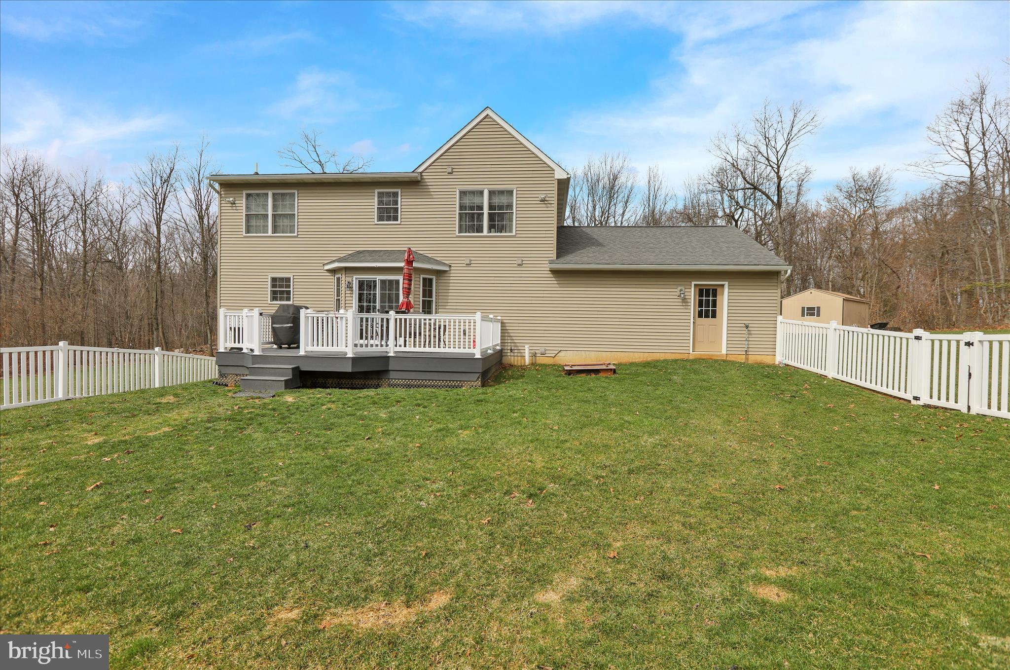 402 Mountainside Road Temple, PA 19560 - Photo 49 of 75 a front view of a house with a garden and yard