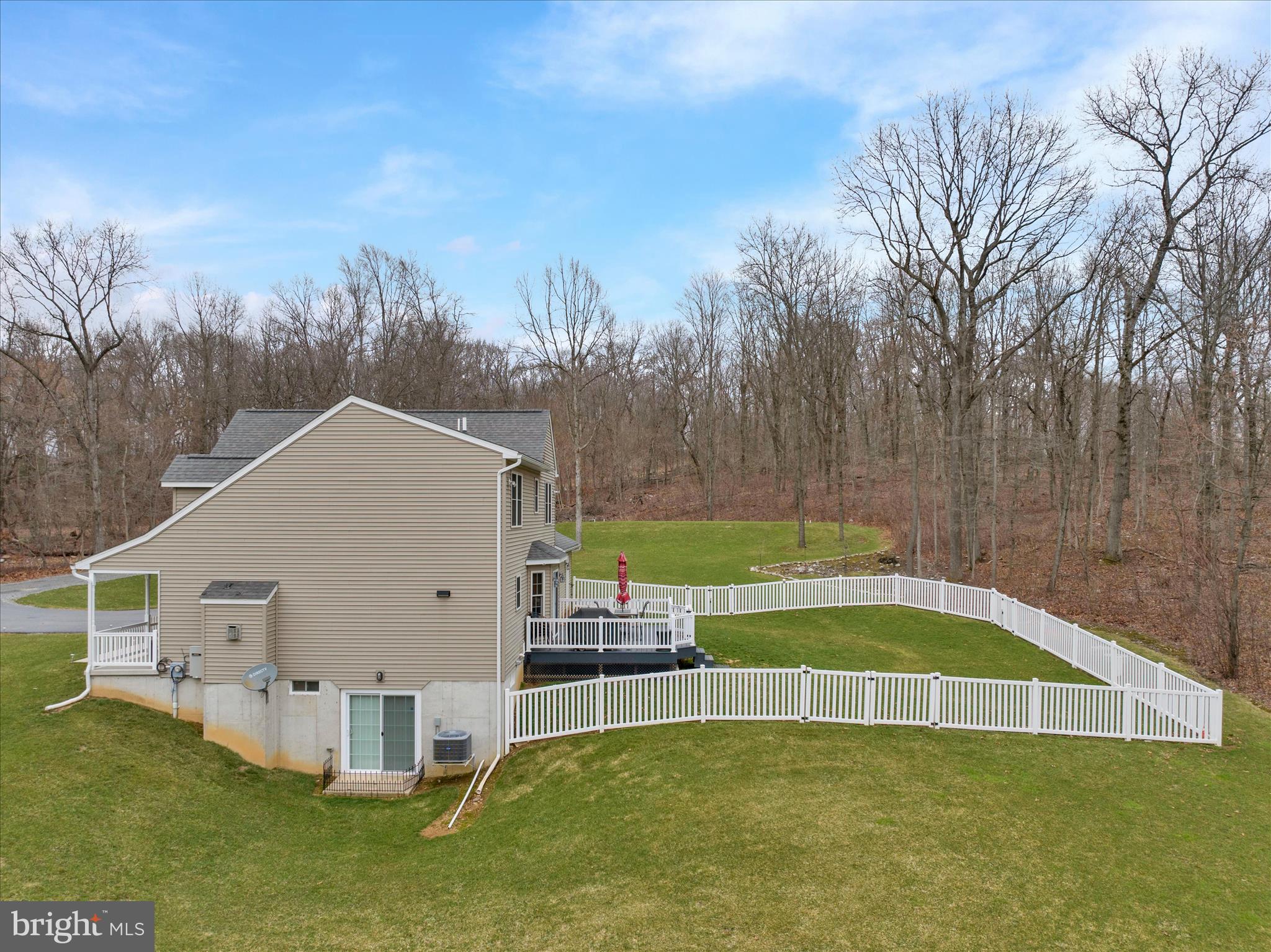 402 Mountainside Road Temple, PA 19560 - Photo 55 of 75 a view of a house with a yard and sitting area