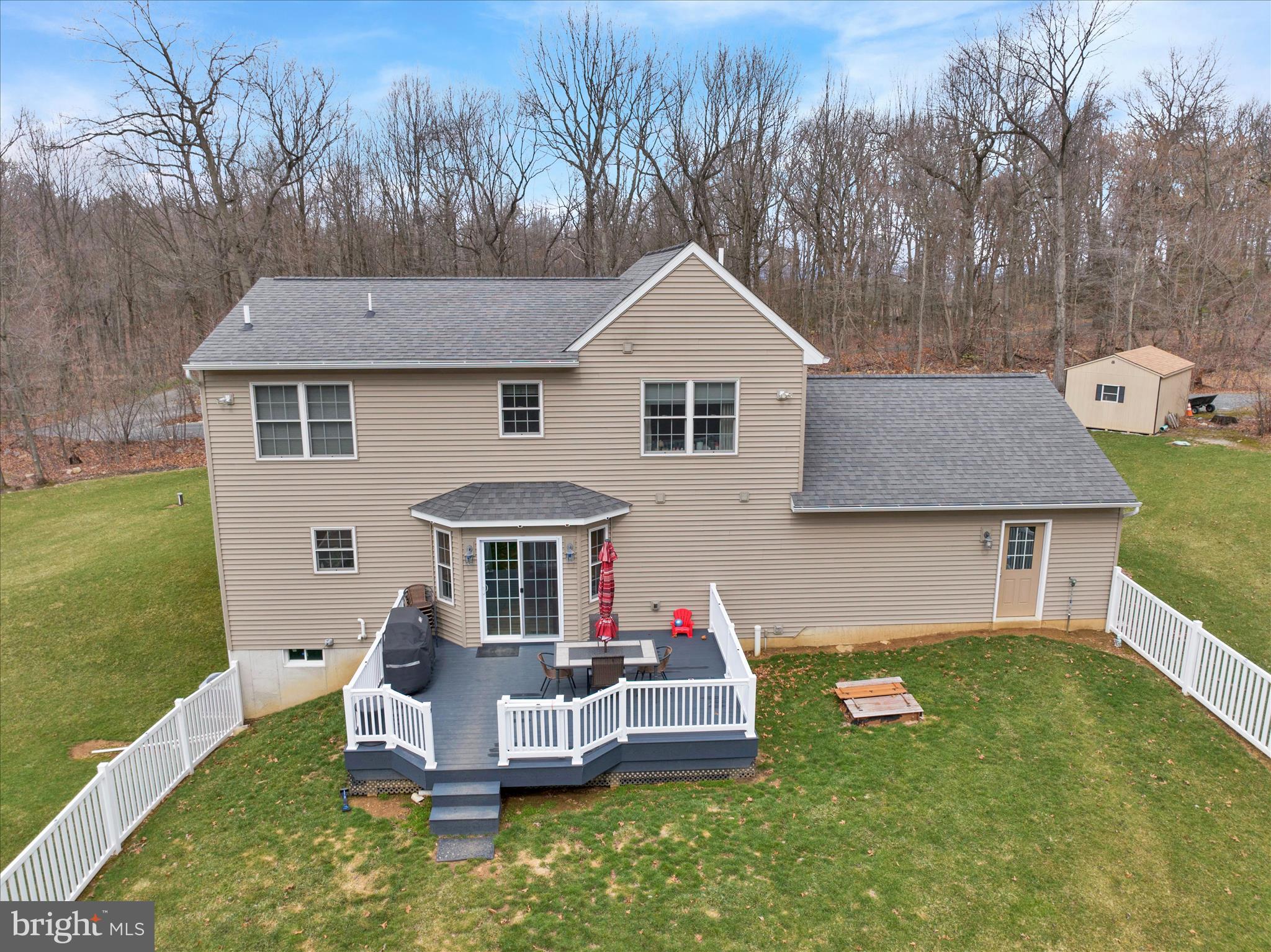 402 Mountainside Road Temple, PA 19560 - Photo 58 of 75 a front view of a house with a yard table and chairs