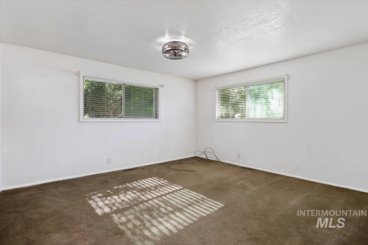 305 Lucille Street Kimberly, ID 83341 - Photo 19 of 36 Unfurnished room with carpet floors and baseboards