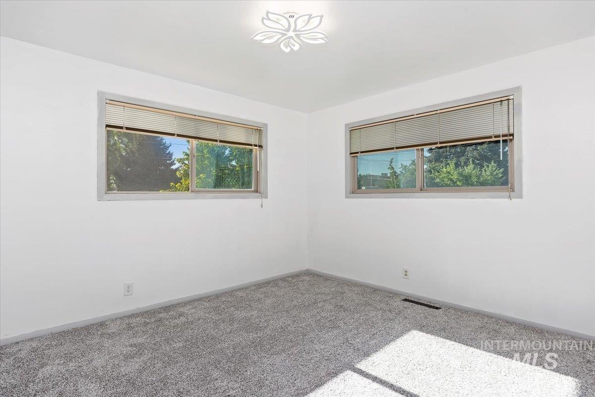 305 Lucille Street Kimberly, ID 83341 - Photo 22 of 36 Unfurnished room with baseboards and carpet floors
