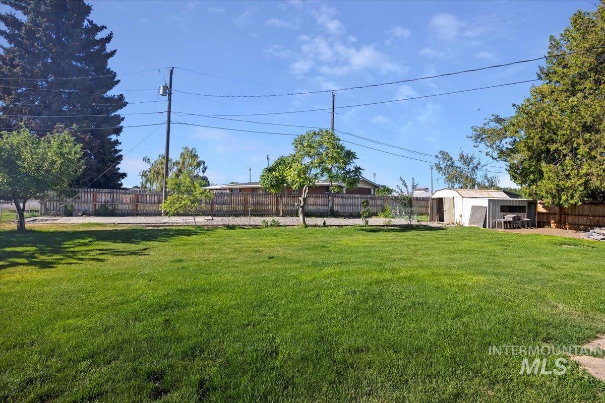 305 Lucille Street Kimberly, ID 83341 - Photo 35 of 36 Fenced backyard with an outbuilding