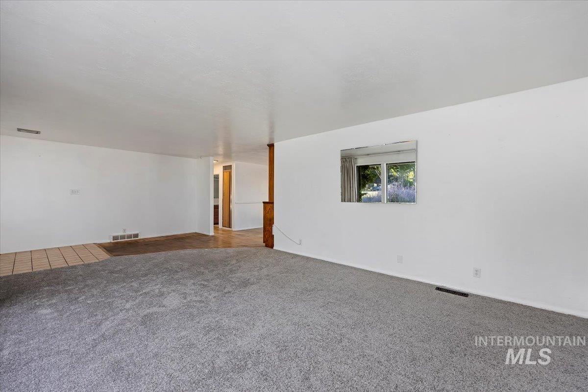 305 Lucille Street Kimberly, ID 83341 - Photo 7 of 36 Empty room featuring carpet flooring