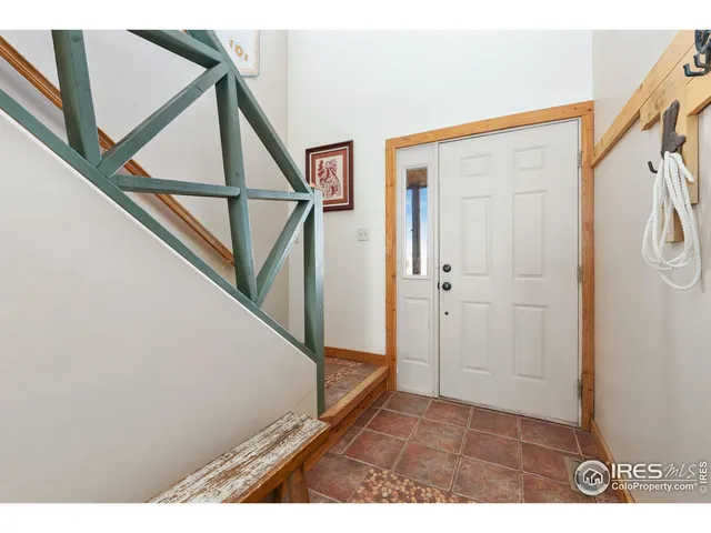 a view of entryway with stairs